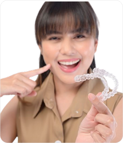 Woman holding Invisalign aligners
